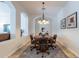 Round dining table with seating for four in a well-lit room at 1351 E Artemis Trl, Queen Creek, AZ 85140