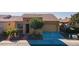 House exterior showcasing a two-car garage and landscaped front yard at 1351 E Artemis Trl, Queen Creek, AZ 85140