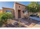 Brick home exterior with a landscaped front yard at 1351 E Artemis Trl, Queen Creek, AZ 85140