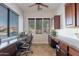 Home office with built-in desks and large windows at 1351 E Artemis Trl, Queen Creek, AZ 85140