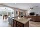 Open concept kitchen with island and living room view at 1351 E Artemis Trl, Queen Creek, AZ 85140