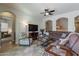 Living room with comfortable seating and a fireplace at 1351 E Artemis Trl, Queen Creek, AZ 85140