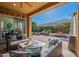 Relaxing patio with seating area and fire pit at 1351 E Artemis Trl, Queen Creek, AZ 85140