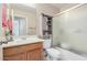 Clean bathroom with a shower/tub combo and wood vanity at 1435 E Debbie Dr, San Tan Valley, AZ 85140