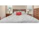 Spacious bedroom with a queen-size bed and wood furniture at 1435 E Debbie Dr, San Tan Valley, AZ 85140