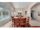 Bright dining room with a glass-top table and wooden chairs at 1435 E Debbie Dr, San Tan Valley, AZ 85140