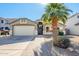 Single-story home with a two-car garage and desert landscaping at 1435 E Debbie Dr, San Tan Valley, AZ 85140