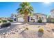Landscaped front yard with drought-tolerant plants and gravel at 1435 E Debbie Dr, San Tan Valley, AZ 85140