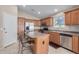 Spacious kitchen with stainless steel appliances and an island at 1435 E Debbie Dr, San Tan Valley, AZ 85140