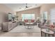 Cozy living room featuring a comfortable sofa and large TV at 1435 E Debbie Dr, San Tan Valley, AZ 85140