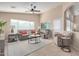 Cozy living room featuring a comfortable sofa and two armchairs at 1435 E Debbie Dr, San Tan Valley, AZ 85140