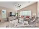 Relaxing living room with sectional sofa and large TV at 1435 E Debbie Dr, San Tan Valley, AZ 85140