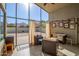 Relaxing sunroom with wicker furniture and a view of the backyard at 1435 E Debbie Dr, San Tan Valley, AZ 85140