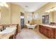Elegant bathroom featuring a clawfoot tub, glass shower, dual vanities, and ample natural light at 16149 E Thistle Dr, Fountain Hills, AZ 85268