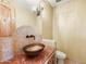 Powder room featuring vessel sink, granite countertop, mosaic backsplash, and decorative lighting at 16149 E Thistle Dr, Fountain Hills, AZ 85268