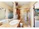 Elegant bathroom features a stone countertop vanity and a glass-enclosed shower at 16149 E Thistle Dr, Fountain Hills, AZ 85268