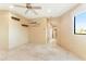 Bright bedroom with neutral walls, tile flooring, and minimalist decor offering a modern and calming atmosphere at 16149 E Thistle Dr, Fountain Hills, AZ 85268