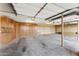 Spacious garage equipped with ample storage cabinets, shelving, and durable concrete flooring at 16149 E Thistle Dr, Fountain Hills, AZ 85268