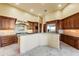 Kitchen boasting high-end appliances, custom cabinetry, and granite countertops at 16149 E Thistle Dr, Fountain Hills, AZ 85268