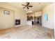 Spacious living area features a stone fireplace, tile floors and an open floor plan at 16149 E Thistle Dr, Fountain Hills, AZ 85268