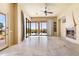 Bright living space with tile floors, glass doors, fireplace and views of the outdoor pool at 16149 E Thistle Dr, Fountain Hills, AZ 85268