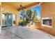 Covered outdoor kitchen featuring a built-in grill, fireplace, and scenic views at 16149 E Thistle Dr, Fountain Hills, AZ 85268