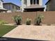 Landscaped backyard with a patio and artificial turf at 1669 S Wallrade Ln, Gilbert, AZ 85295