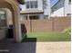 Backyard with artificial turf and a paved patio at 1669 S Wallrade Ln, Gilbert, AZ 85295