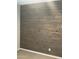 Accent wall with gray wood-style planks in bedroom at 1669 S Wallrade Ln, Gilbert, AZ 85295