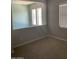 Bright bedroom with neutral walls and carpet at 1669 S Wallrade Ln, Gilbert, AZ 85295