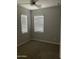Bright bedroom with neutral walls and carpeting at 1669 S Wallrade Ln, Gilbert, AZ 85295