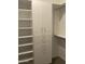 White built-in wardrobe with shelves and drawers at 1669 S Wallrade Ln, Gilbert, AZ 85295