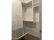 Bright walk-in closet, complete with drawers and a hamper at 1669 S Wallrade Ln, Gilbert, AZ 85295