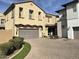 Two-story stucco home showcasing a paved driveway, manicured landscaping, and a two-car garage at 1669 S Wallrade Ln, Gilbert, AZ 85295