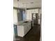 Kitchen island with granite countertop and a blue accent at 1669 S Wallrade Ln, Gilbert, AZ 85295
