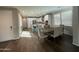 Open layout integrating a dining area, a gourmet kitchen, and a living space with plenty of natural light at 1669 S Wallrade Ln, Gilbert, AZ 85295