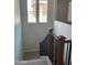 Elegant staircase with wood railing leading to upper level at 1669 S Wallrade Ln, Gilbert, AZ 85295