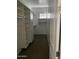 Spacious walk-in closet with shelves and hanging rods at 1669 S Wallrade Ln, Gilbert, AZ 85295