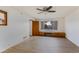 Bright bedroom with window seat, ceiling fan, and wood-look floors at 1905 W Cambridge Ave, Phoenix, AZ 85009