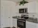 Modern kitchen with granite countertops and stainless steel appliances at 227 W Bobcat Ct, Casa Grande, AZ 85122