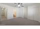 Bedroom with carpeting, double closets and bathroom access at 22814 W Cantilever St, Buckeye, AZ 85326