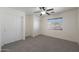 Spacious bedroom with carpeting, double closets, and ceiling fan at 22814 W Cantilever St, Buckeye, AZ 85326