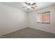 Well-lit bedroom featuring a ceiling fan and window blinds at 22814 W Cantilever St, Buckeye, AZ 85326