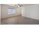 Living room with tile floors and ceiling fan at 22814 W Cantilever St, Buckeye, AZ 85326