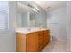 Bathroom with double vanity and light wood cabinets at 2440 W Bloch Rd, Phoenix, AZ 85041