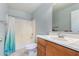 Clean bathroom with a shower/tub combo and wood vanity at 2440 W Bloch Rd, Phoenix, AZ 85041