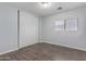 Bright bedroom with wood laminate flooring and mirrored closet doors at 2440 W Bloch Rd, Phoenix, AZ 85041
