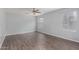 Bright bedroom with ceiling fan and wood-look flooring at 2440 W Bloch Rd, Phoenix, AZ 85041