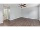 Bedroom with ceiling fan and wood-look flooring at 2440 W Bloch Rd, Phoenix, AZ 85041