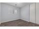 Well lit bedroom featuring wood-look laminate flooring at 2440 W Bloch Rd, Phoenix, AZ 85041